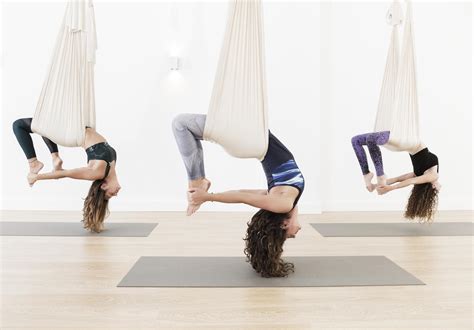 Drawing your shoulders back, lift the center of your chest. . Da flying yoga photos